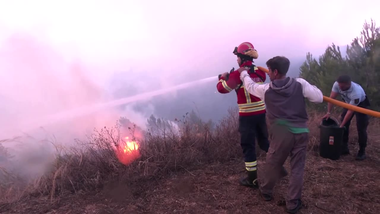 Firefighters tackle wildfire near Lisbon, Portugal