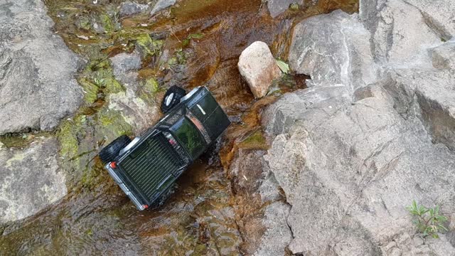 a radio-controlled car driving in the water