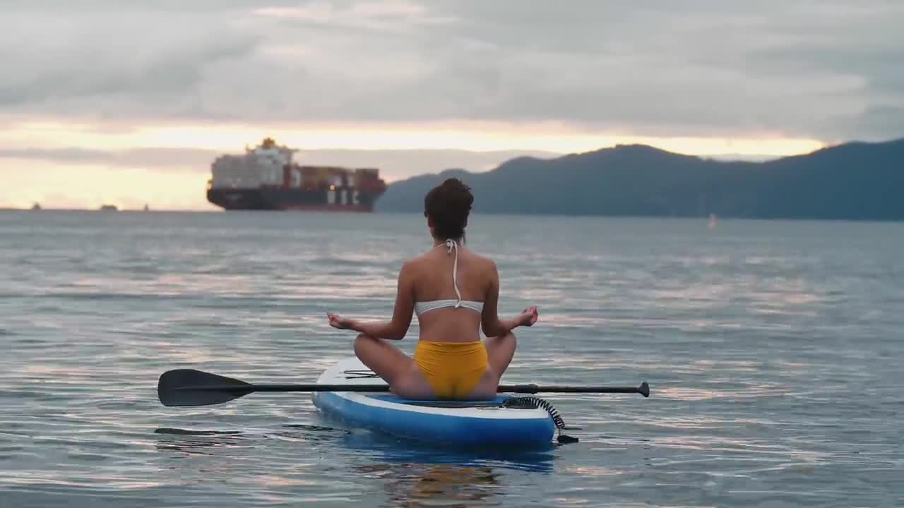 Practicing yoga in the calm of the seas