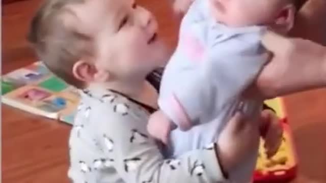 Funny Baby seating and a bully playing