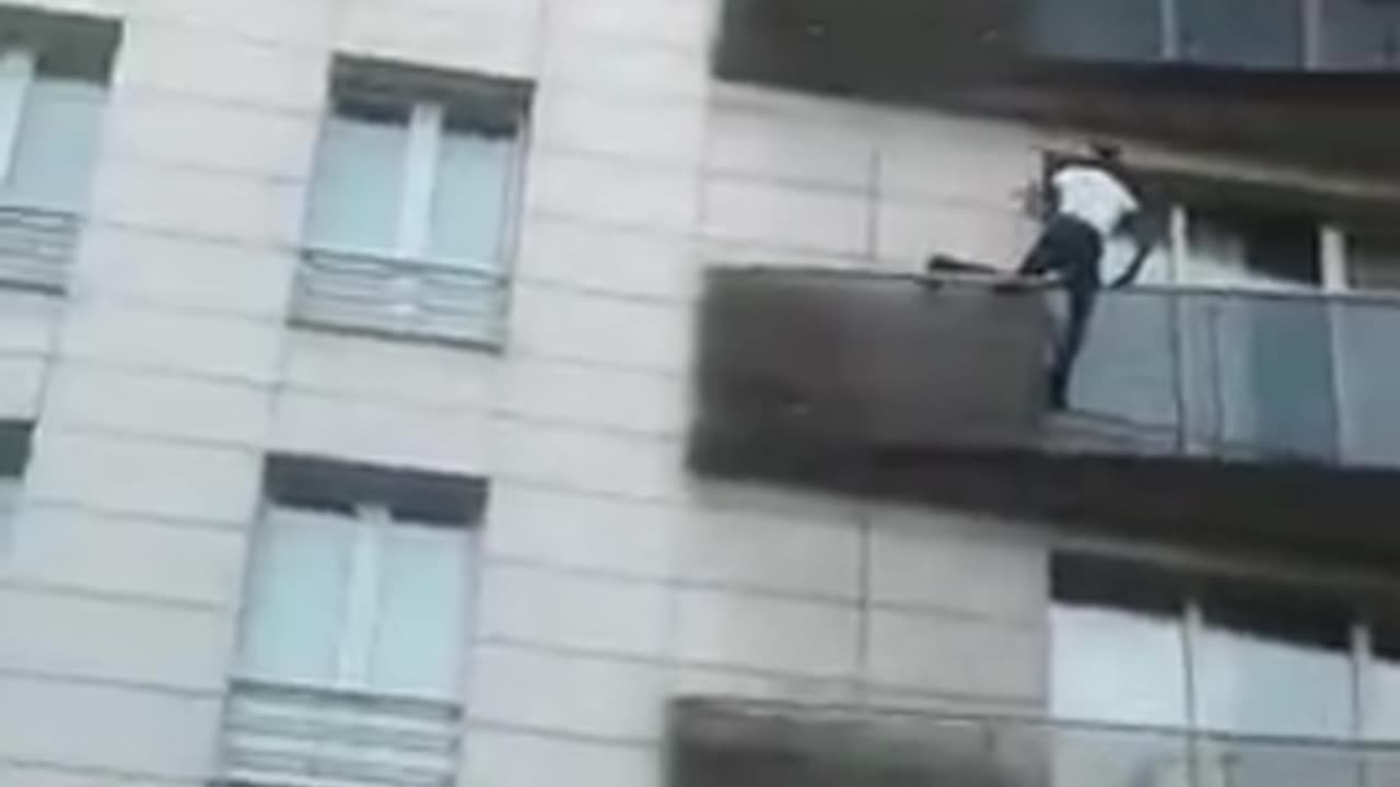 Man scales a building in Paris to save a child dangling from a 5th-floor balcony