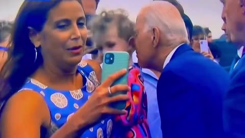 Joe Biden Caught Nibbling On A Young Child