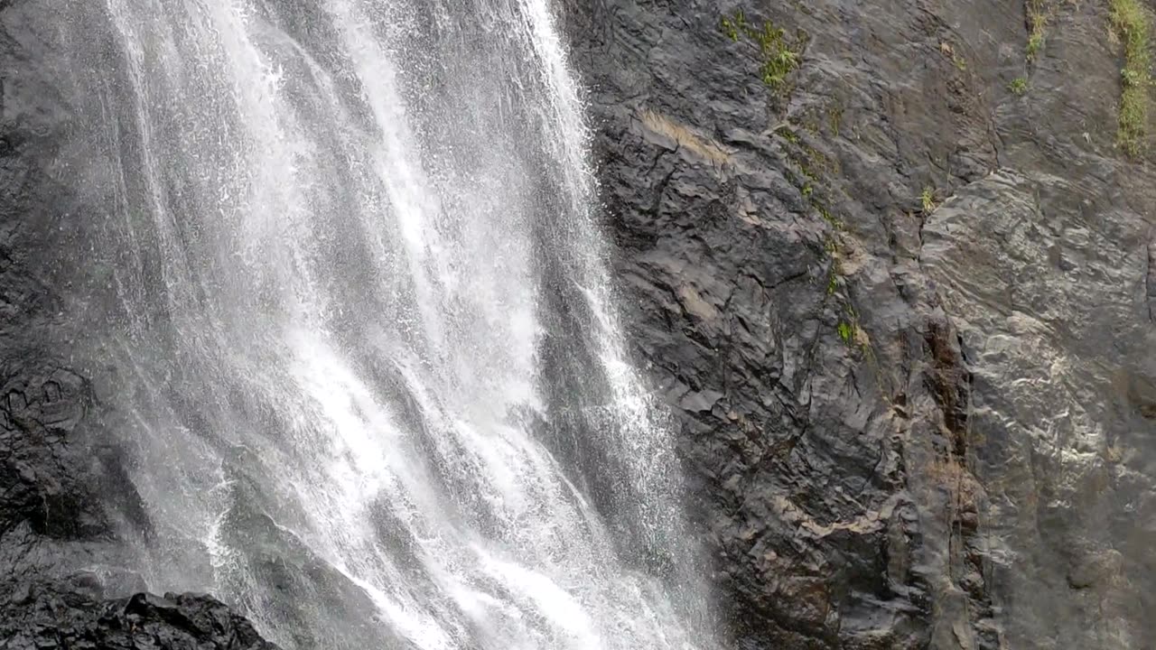 Nature's masterpiece: Capturing the awe-inspiring allure of waterfall | #nature #shorts #status