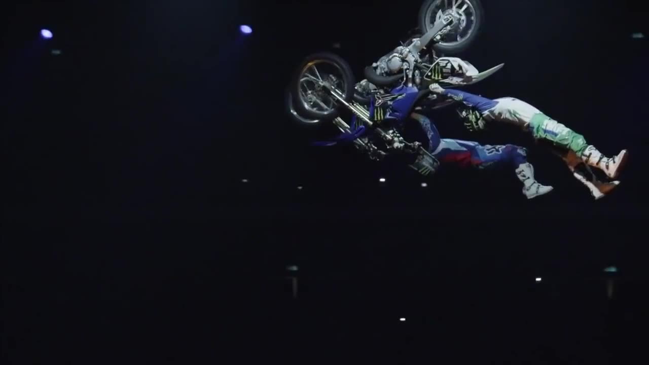 Two Men Doing Stunts On Motorcycles