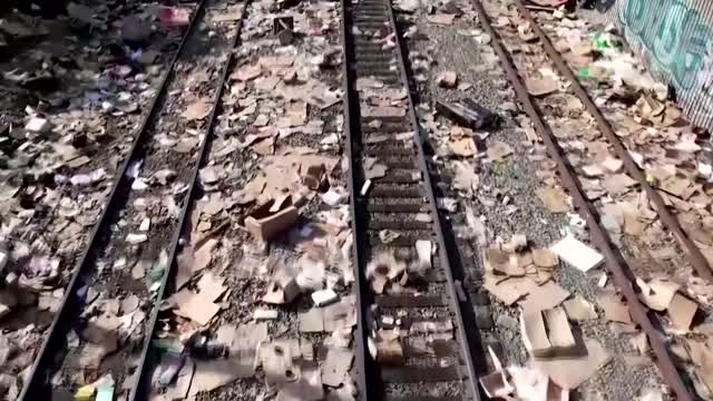 Thousands of looted packages line LA train tracks