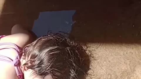 Child Naps In Cool Hose Water