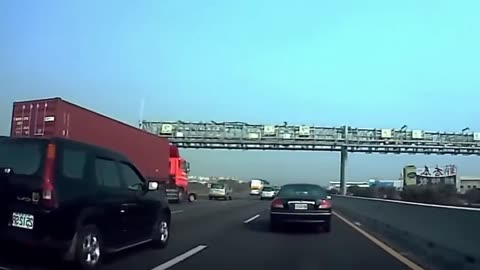 Speeding Car Tips Semi-Truck on Busy Highway