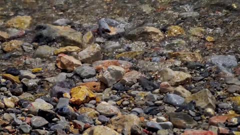 The waves were pounding against the stones