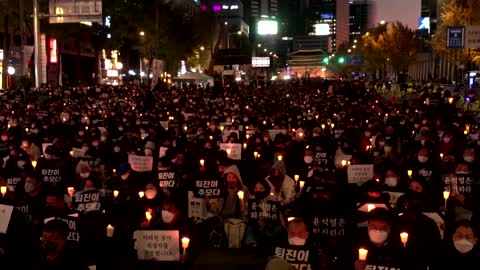 Candle-lit vigil for South Korea's crush victims