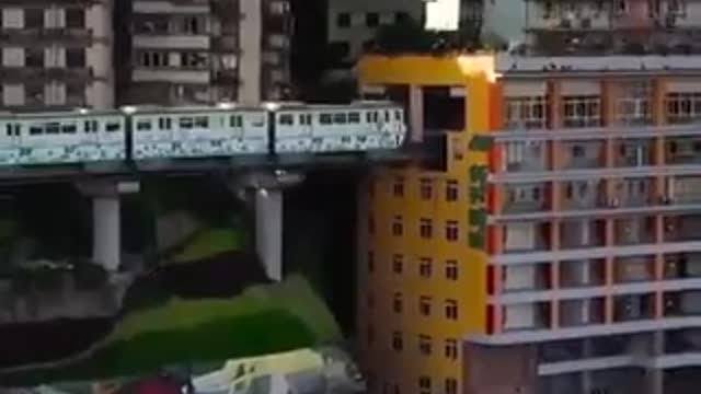 China have lived with an actual train going through the building for 11 years now.