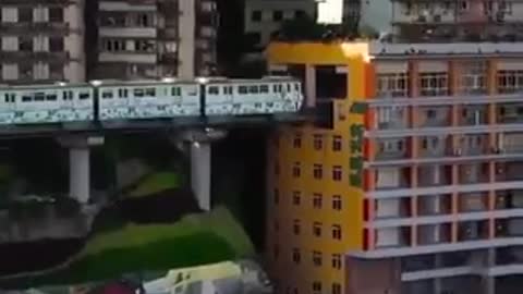 China have lived with an actual train going through the building for 11 years now.