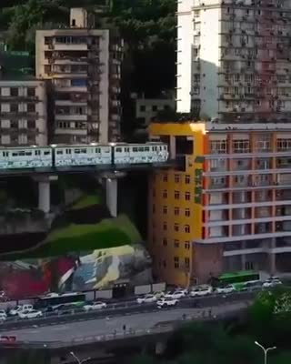 China have lived with an actual train going through the building for 11 years now.