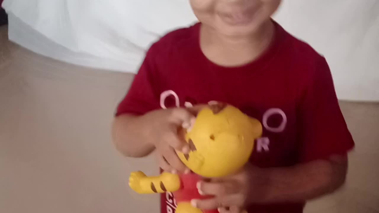 Playing. With tiger toy