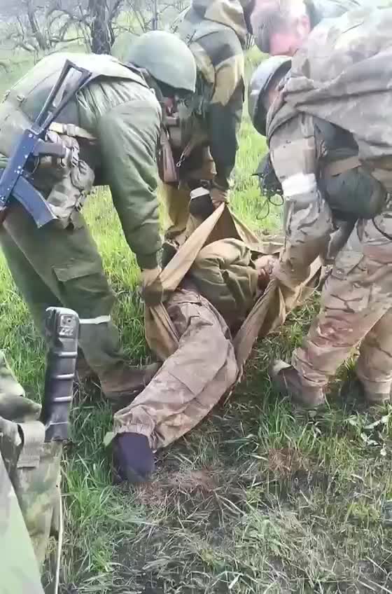 Russian military evacuate a wounded Ukrainian soldier who was abandoned by his unit