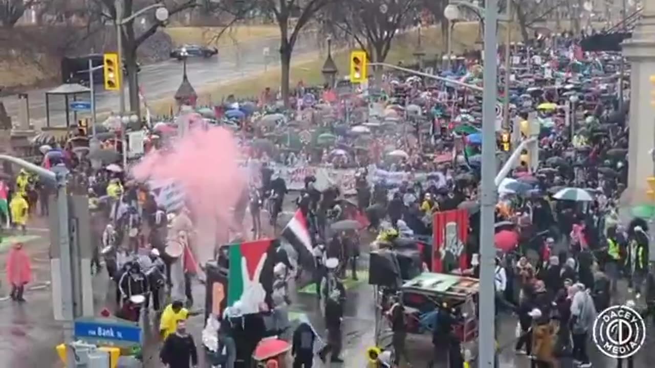 TURDEAU'S CANADA Palestinian demonstrators, led by Palestinian Spiderman, are popping off smoke gren