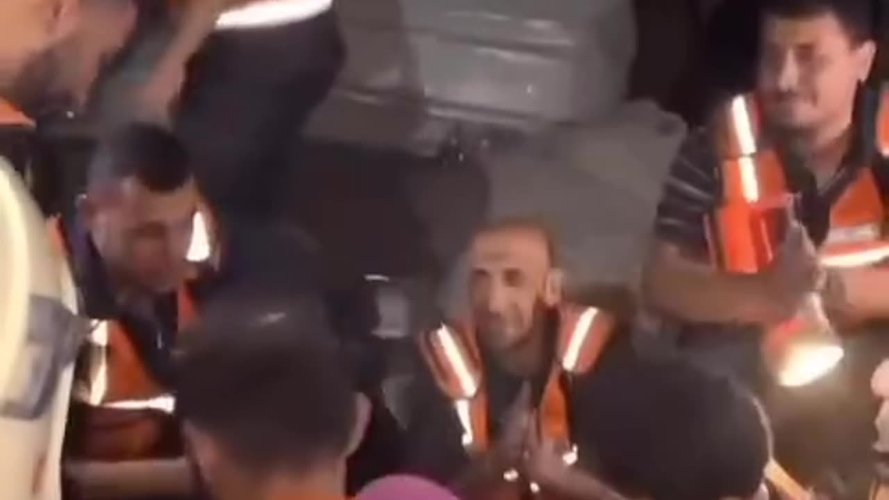 Civil defense crews rescue people from the rubble