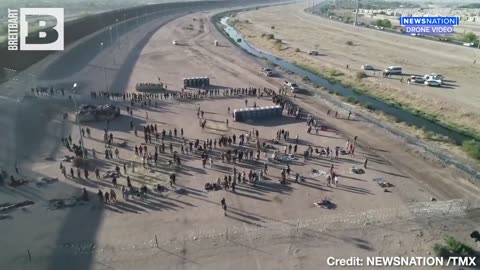 Drone footage from NewsNation reveals large groups of immigrants gathered at the El Paso border