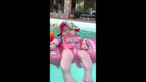 Baby sleeping in the pool!???