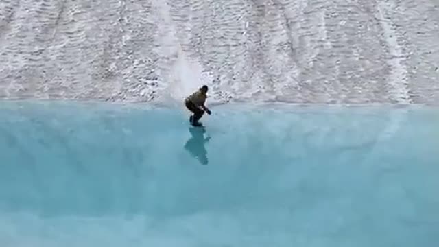 Snowboarding with @SkylerGallardo across this glass-like lake, a superb scene shot