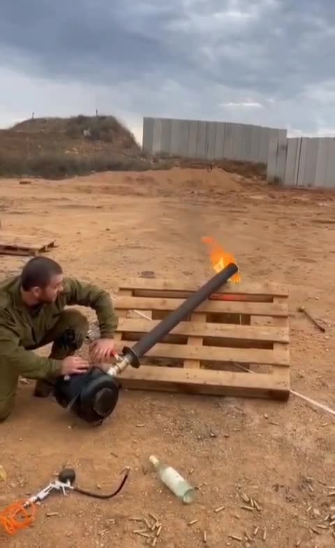 Israeli soldiers using broken objects fail to shoot flame over wall