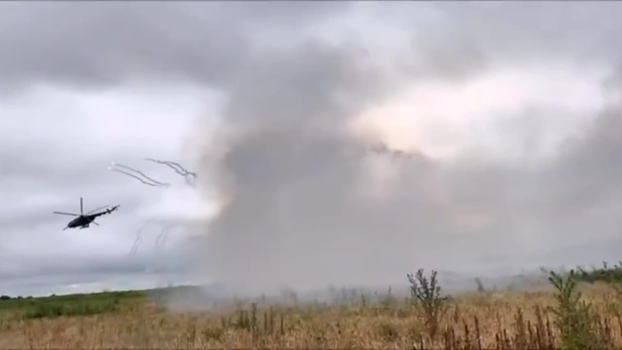 A pair of Mi-8MT striking Russian positions with unguided missiles.