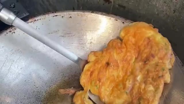 the moment the eggs drop into that hot oil to make traditional Thai Kai Jeow
