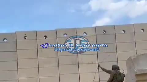 Isreali soldiers shoots flaming arrows over wall