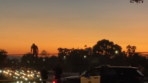 Naked guy threatening to jump off Park Ave. bridge over the 5 Freeway in San Diego.