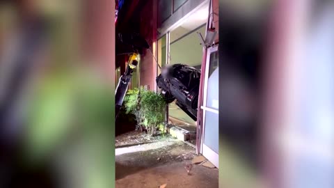 California driver safe after car plunges into fitness center pool