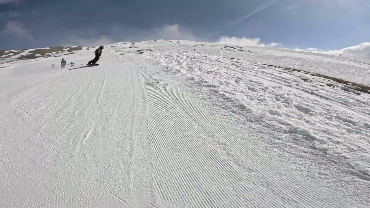 Snowboarder Wipes Out Skiers