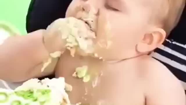 Cute Baby eating cake