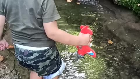 Little Boy Falls in Pond