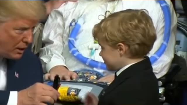 Cute kid tries to hug Trump