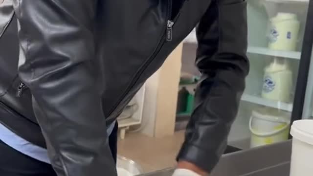 This guy is making cheese in a leather jacket
