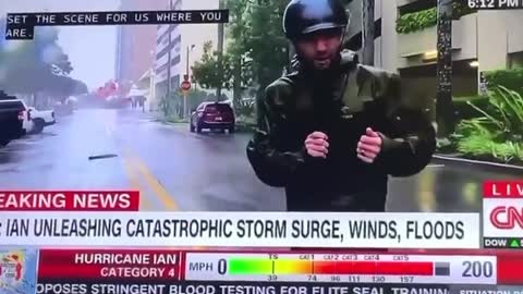 Watch the Guy at the Back Calmly Walk to His Car While CNN Reports on Hurricane Ian