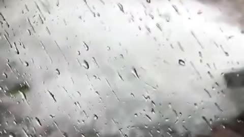 Hailstones Spill Out From Gutters and Pile Up on Ground During Massive Hailstorm