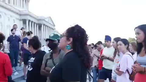 AOC Maskless at large gathering. Puts mask on for photo op. Takes it off to talk to attendees.