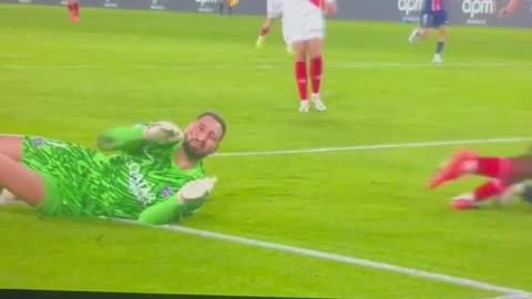 Gianluigi Donnarumma is taken after he receives a horrible tackle to his face.