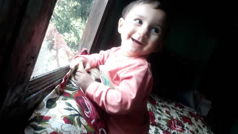 Laughing and playing cute baby