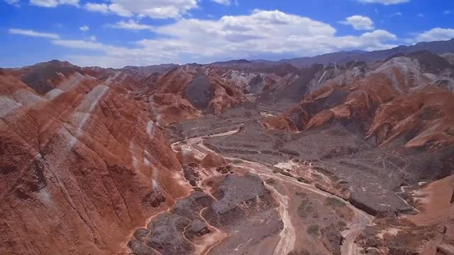 Deserted areas covered with sand, very sparse vegetation, little rain, and dry air