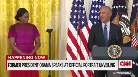 Barack Obama gives a speech after the unveiling of his White House portrait