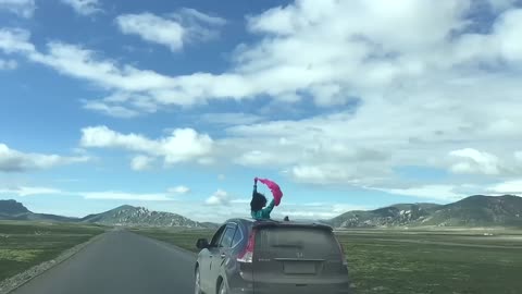 Galloping under the blue sky and white clouds