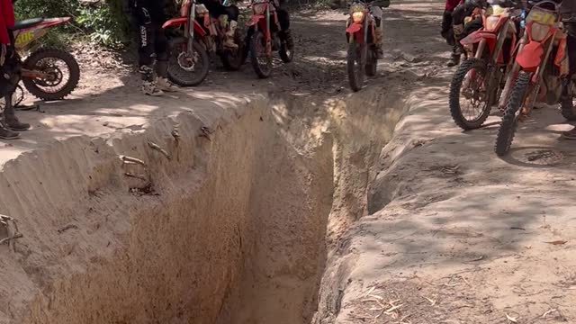 Dirtbiker Falls Into Mud