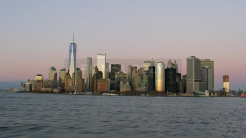 Tall city buildings tower over the water