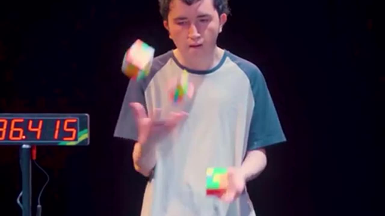 3 Rubric's Cubes solved by juggling.