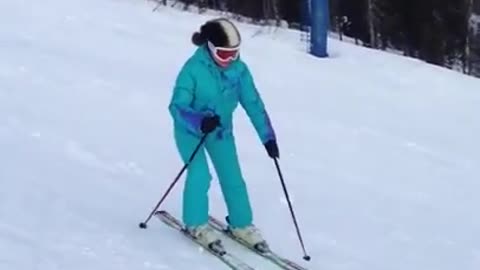 Man Loses Balance While Skiing and Slides Down the Hill