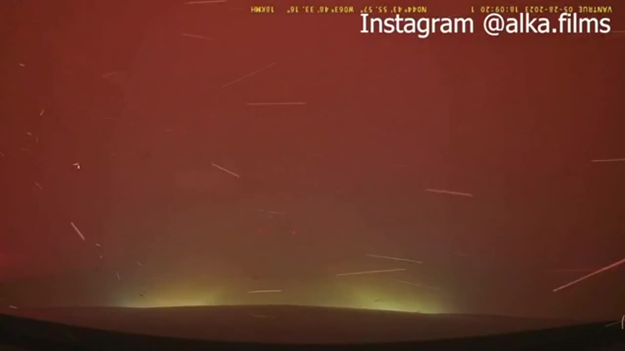 Canada, a car narrowly survive a drive through raging wildfires on either side of the road.