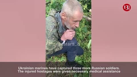 Ukrainian marines provide medical aid to wounded Russians they captured