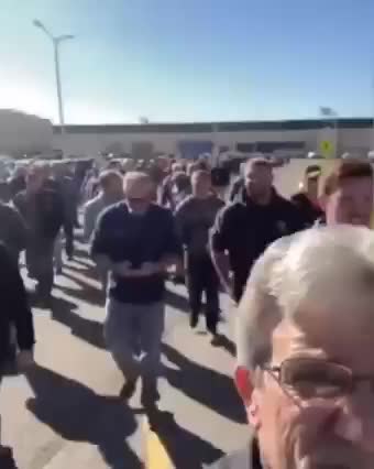 Group of workers walk off the job