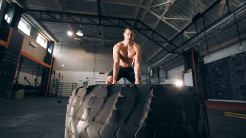 Muscular man doing Crossfit exercises